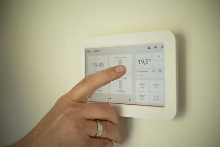 Digital thermostat on cream wall